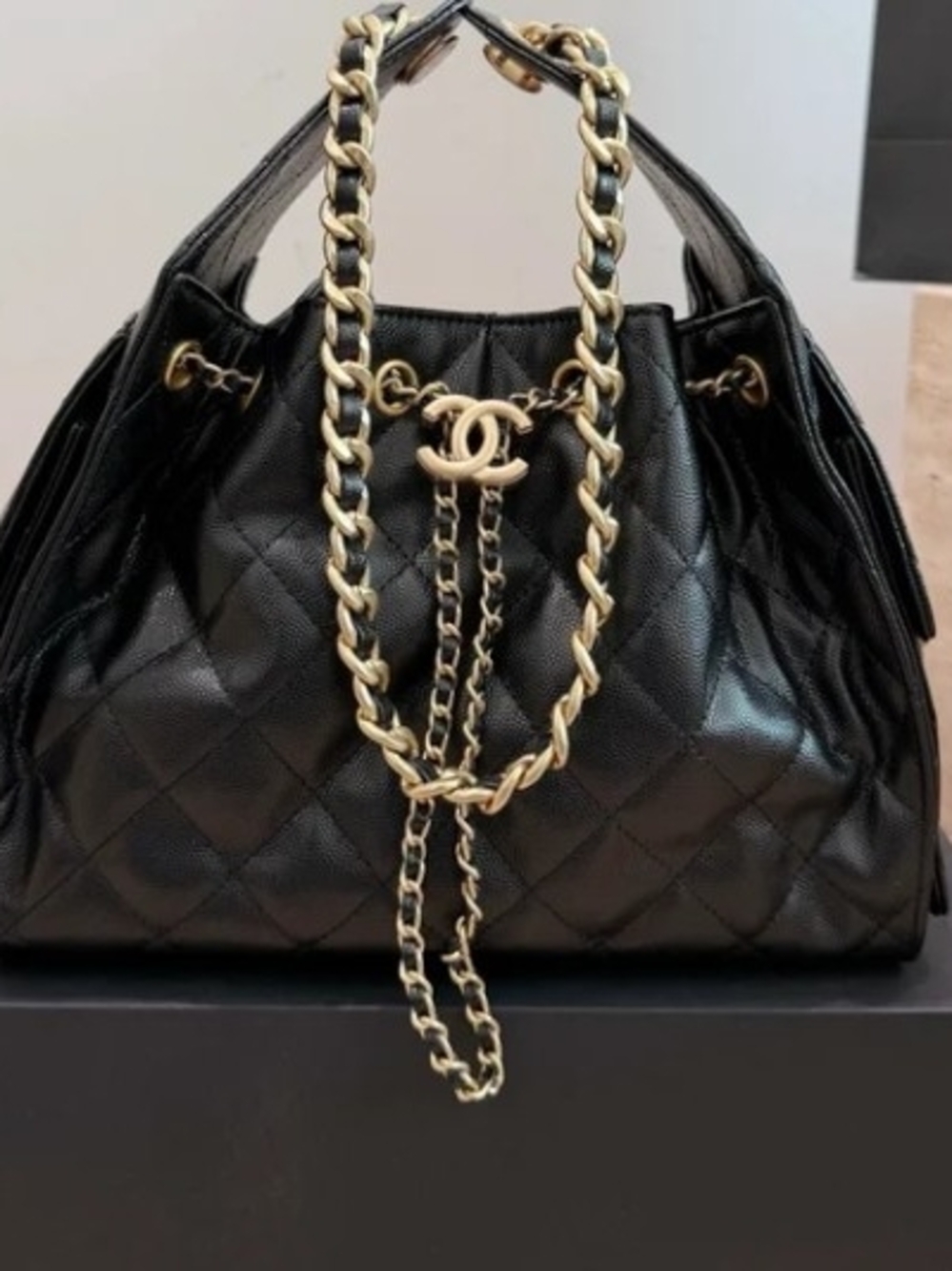 CHANEL Black Quilted Leather Drawstring Shoulder Bag with Gold Chain